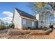 The exterior of this home shows the backyard with a retaining wall at 565 Saint James Ct, Lawrenceville, GA 30044