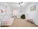 Playful bedroom with carpet, white walls, ceiling fan, and charming decor for children at 565 Saint James Ct, Lawrenceville, GA 30044