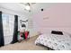 Charming bedroom with carpet, complemented by a ceiling fan and black-out curtains at 565 Saint James Ct, Lawrenceville, GA 30044