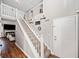 Bright foyer with hardwood floors, staircase leading to the second floor, and a large front door at 565 Saint James Ct, Lawrenceville, GA 30044