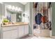 Bathroom featuring a granite countertop, modern mirror, and stylish shower curtain at 970 Sidney Marcus Blvd # 1217, Atlanta, GA 30324