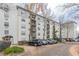 Exterior view of the apartment complex, featuring a parking area, manicured landscaping and multiple balconies at 970 Sidney Marcus Blvd # 1217, Atlanta, GA 30324