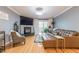 Cozy living room featuring a brown leather sectional, fireplace, and access to an outdoor balcony at 970 Sidney Marcus Blvd # 1217, Atlanta, GA 30324