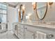 Luxurious bathroom with double vanity, marble countertop, and decorative lighting at 1180 John Collier Rd, Atlanta, GA 30318