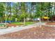 Outdoor community space with ample seating, green space, and landscaping at 1180 John Collier Rd, Atlanta, GA 30318