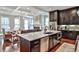 Modern kitchen featuring a large center island, stainless steel appliances, and an open layout at 1180 John Collier Rd, Atlanta, GA 30318