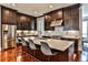 Gourmet kitchen featuring stone countertops, a breakfast bar, and stainless steel appliances at 1180 John Collier Rd, Atlanta, GA 30318