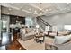 Spacious living room with hardwood floors, decorative coffered ceilings, and modern furnishings at 1180 John Collier Rd, Atlanta, GA 30318