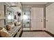 Well-organized mudroom with bench seating, glass shelving, and ample storage space at 1180 John Collier Rd, Atlanta, GA 30318