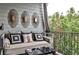 Relaxing outdoor seating area with stylish furniture and decorative wall accents at 1180 John Collier Rd, Atlanta, GA 30318