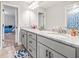 Bright bathroom featuring double sink vanity, granite countertops, and modern fixtures at 1570 Butler Bridge Rd, Covington, GA 30016