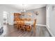 Dining room with hardwood floors, traditional wood furniture, and a deer head mount on the wall at 1570 Butler Bridge Rd, Covington, GA 30016