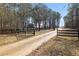 Gated driveway leading to the property with 'Posted' sign at 1570 Butler Bridge Rd, Covington, GA 30016