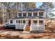 Charming two-story home with a covered porch and traditional design elements at 1570 Butler Bridge Rd, Covington, GA 30016