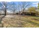 A view of the farm house and horse stalls from across the property at 1570 Butler Bridge Rd, Covington, GA 30016