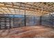 Covered horse stall featuring wood plank construction with a metal roof at 1570 Butler Bridge Rd, Covington, GA 30016