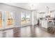 Eat-in kitchen featuring hardwood floors, island with seating, and a door leading to the deck at 1570 Butler Bridge Rd, Covington, GA 30016