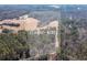 Aerial shot showing approximately 37.48 acres of land with a mix of cleared areas and wooded sections at 1570 Butler Bridge Rd, Covington, GA 30016