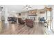 Open floorplan living room with hardwood floors, stone fireplace, and windows for natural light at 1570 Butler Bridge Rd, Covington, GA 30016