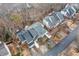 Aerial view of townhomes showcasing their rooflines and surrounding landscape with bare trees at 1675 Paddlewheel Dr, Marietta, GA 30062