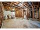 Unfinished basement with exposed wooden beams and ductwork, offering potential for customization at 1675 Paddlewheel Dr, Marietta, GA 30062