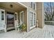 Welcoming front porch featuring a decorative glass front door, adorned with a beautiful planter and decorative statues at 1675 Paddlewheel Dr, Marietta, GA 30062