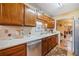 Kitchen with wooden cabinetry, stainless steel dishwasher, and bright countertops at 1675 Paddlewheel Dr, Marietta, GA 30062