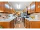 Galley kitchen featuring wooden cabinets, stainless steel appliances, and light countertops at 1675 Paddlewheel Dr, Marietta, GA 30062