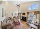 Bright living room with high ceilings, large windows, a fireplace, and tasteful decor with cozy seating at 1675 Paddlewheel Dr, Marietta, GA 30062