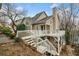 This home boasts a spacious back deck area perfect for outdoor gatherings, and stairs lead to a lower yard area at 1675 Paddlewheel Dr, Marietta, GA 30062