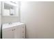 Bathroom featuring a white vanity with a mirror, a sink and storage underneath at 2397 Shady Maple Trl, Loganville, GA 30052