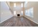 Bright living room featuring soaring ceilings, a fireplace, and lots of natural light at 2397 Shady Maple Trl, Loganville, GA 30052