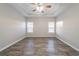 Bright main bedroom with a tray ceiling, a ceiling fan, and lots of natural light at 2397 Shady Maple Trl, Loganville, GA 30052