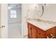 Bathroom with granite countertop vanity and single sink next to the entry to the bedroom at 2658 Stonehenge Ct, Dunwoody, GA 30360