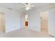 Neutral carpeted bedroom with white walls and ceilings shows doorways to the bathroom and closet at 2658 Stonehenge Ct, Dunwoody, GA 30360