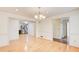 Spacious dining room features hardwood floors and view to the kitchen at 2658 Stonehenge Ct, Dunwoody, GA 30360