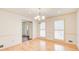 Open dining room with hardwood floors, chandelier, and natural light at 2658 Stonehenge Ct, Dunwoody, GA 30360