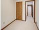 Hallway with neutral carpet and paint with access to other rooms at 2658 Stonehenge Ct, Dunwoody, GA 30360