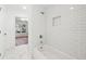 Bathroom features a shower, tub, and white subway tile at 438 Ansley St, Decatur, GA 30030