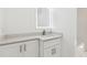 Bathroom vanity featuring white cabinets and a stylish mirror at 438 Ansley St, Decatur, GA 30030