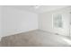 Bright, open bedroom featuring neutral walls, carpet, and a window at 438 Ansley St, Decatur, GA 30030