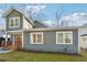 Charming home featuring wood trim porch, green siding and a well-maintained front yard at 438 Ansley St, Decatur, GA 30030