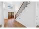 Inviting foyer with hardwood floors, a staircase, and large windows at 438 Ansley St, Decatur, GA 30030