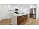 Kitchen featuring quartz countertops, stainless steel appliances, and a large island at 438 Ansley St, Decatur, GA 30030