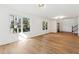 Bright open-plan living room with hardwood floors, large windows, and a staircase at 438 Ansley St, Decatur, GA 30030