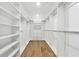 Large walk-in closet with custom shelving and hardwood floors at 438 Ansley St, Decatur, GA 30030