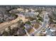 Wide aerial view of the neighborhood and golf course with lush greenery in a suburban setting at 2560 Millwater Xing, Dacula, GA 30019