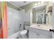 Well-lit bathroom featuring a tub/shower and a clean white vanity at 2560 Millwater Xing, Dacula, GA 30019