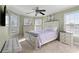 Bright bedroom with large windows, dresser, bed and plenty of space at 2560 Millwater Xing, Dacula, GA 30019