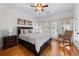 Cozy bedroom with hardwood floors, natural light, and a decorative rocking chair at 2560 Millwater Xing, Dacula, GA 30019